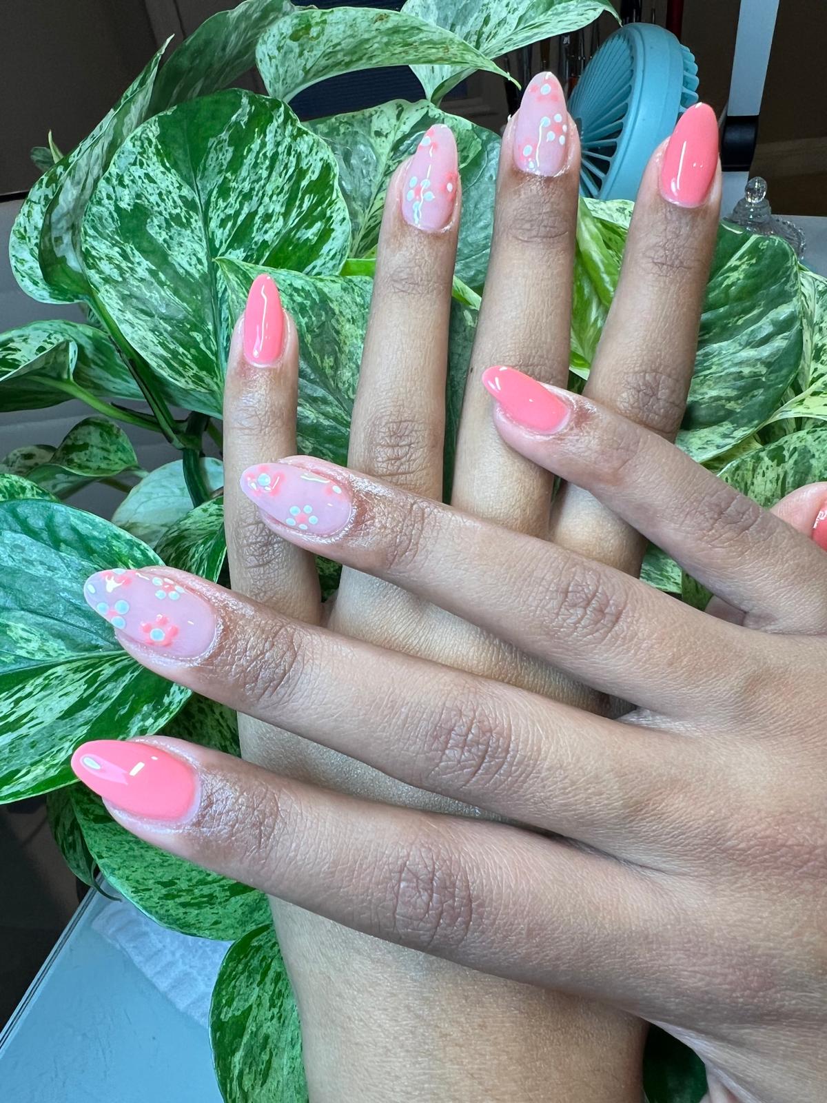 Coral pink nails with floral art