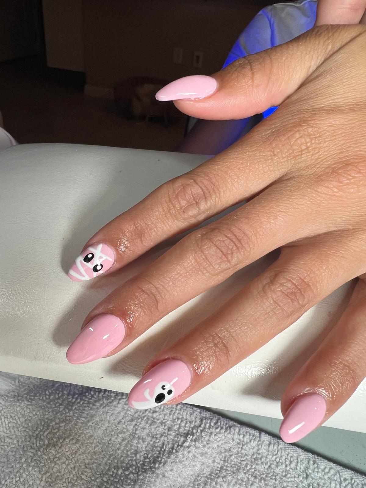 Pink nails with ghost art